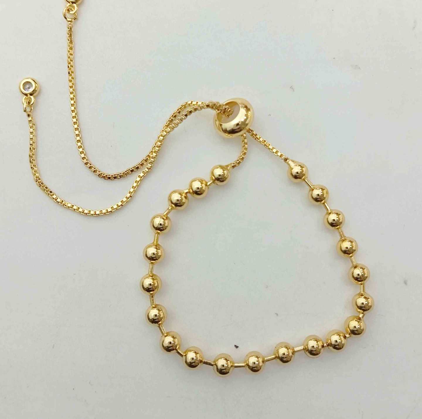 Pulsera Bañado en Oro Pelotita Ajustable 4mm